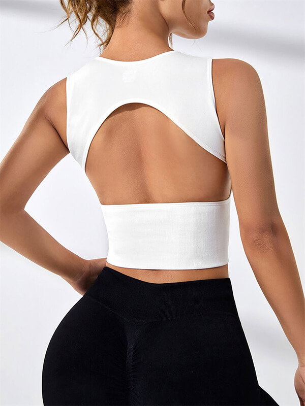 Stylish women's white backless tank top for Pilates, showcasing breathable and quick-drying design. Ideal for yoga and sports activities.